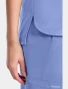 Side vent detail of Cherokee Workwear Originals Ultra Women's Tuckable V-Neck Scrub Top CK954A in Ciel