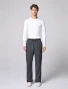 Full-length model view of Cherokee Workwear Revolution Men's 12-Pocket Straight Leg Cargo Scrub Pant CK00001 in Pewter
