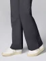 Flare hem and side vent detail of Cherokee Workwear Revolution Women's Mid Rise Flare Cargo Scrub Pant CK00039 in Pewter