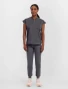 Full-length model view of Healing Hands Purple Label Women's Journey Mandarin Collar Scrub Top 2152 in Pewter