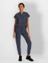 Full-length model view of Healing Hands Purple Label Women's Tate Camo Jogger Scrub Pant 9350 in Pewter