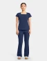 Full-length model view of Med Couture Amp Women's 3-Pocket Square Neck Scrub Top MC704 in Navy