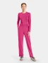 Full-length model view of Med Couture Amp Women's Straight Leg Pull-On Scrub Pant MC103 in Pink Power