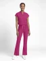 Full-length model view of Med Couture Amp Women's High Rise 4-Pocket Flare Scrub Pant MC104 in Pink Power
