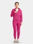 Full-length model view of Med Couture Amp Women's Cropped Warm Up Scrub Jacket MC303 in Pink Power