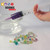 Using a syringe and the included chemicals to make popping beads with the Spherification Kit