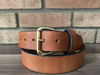 Brown belt with brass hardware