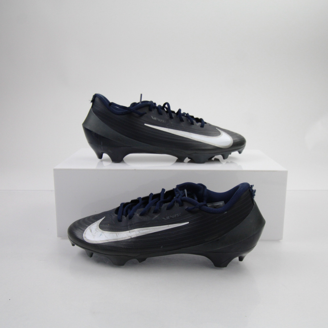 navy blue and white football cleats