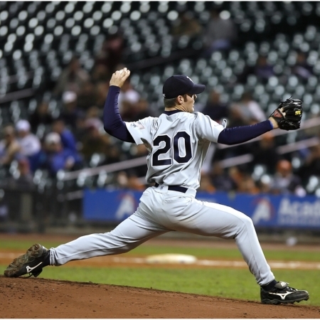 A major league baseball pitcher mid-pitch