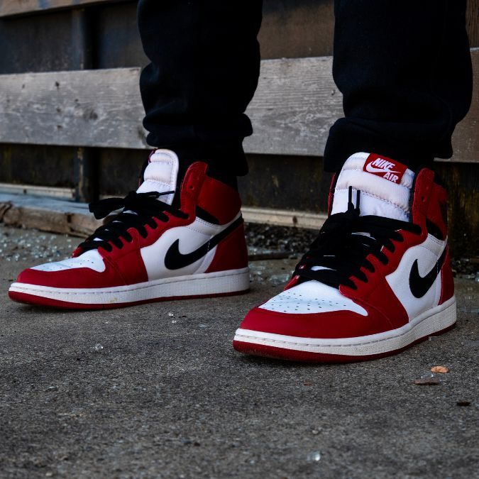 A pair of red, white, and black Jordan Sneakers
