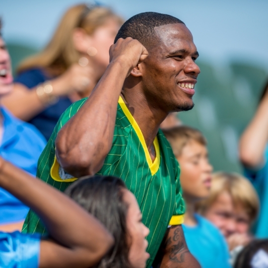 A cheering crowd, supporting their favorite NCAA team
