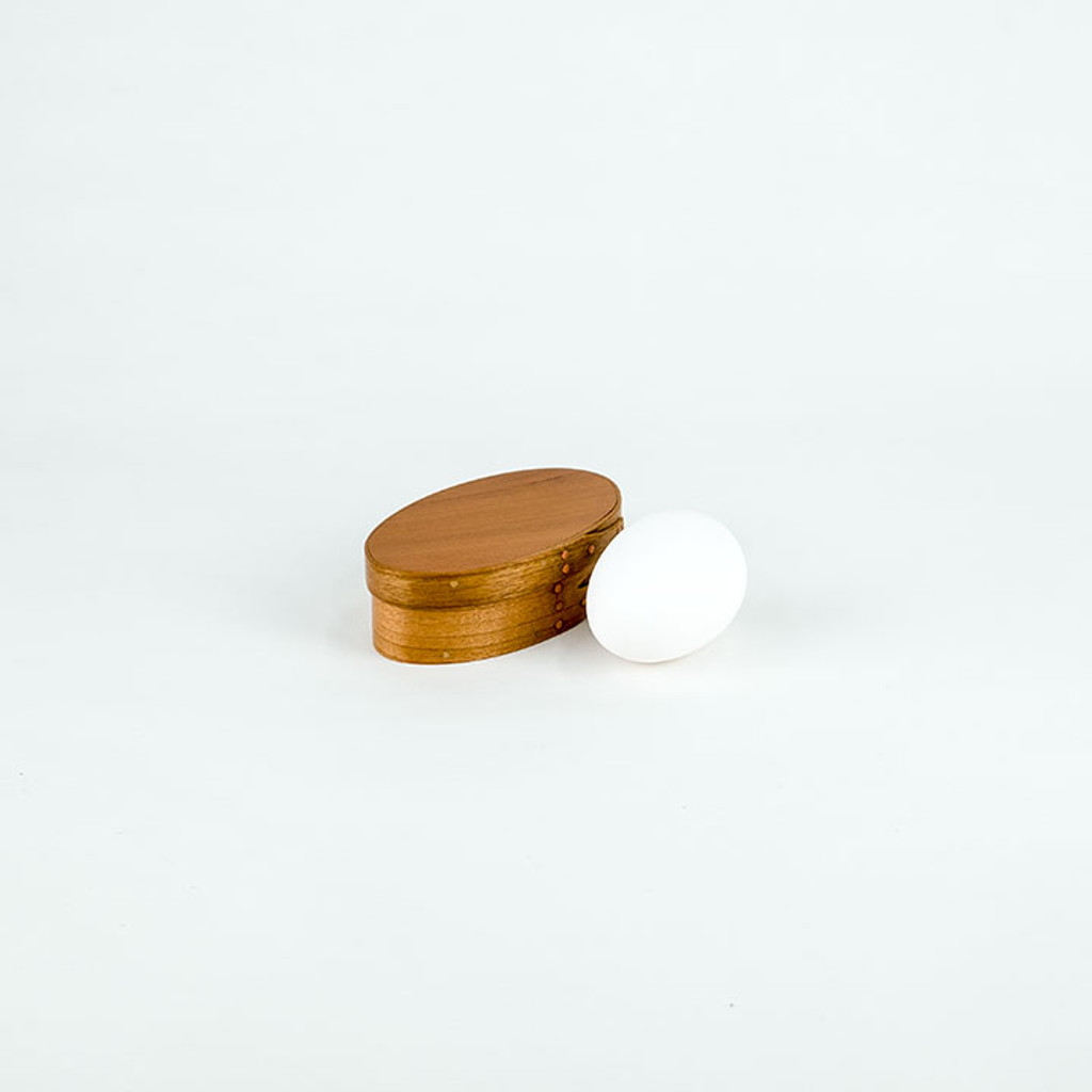 No. 0 shaker oval box organizes everyday items.