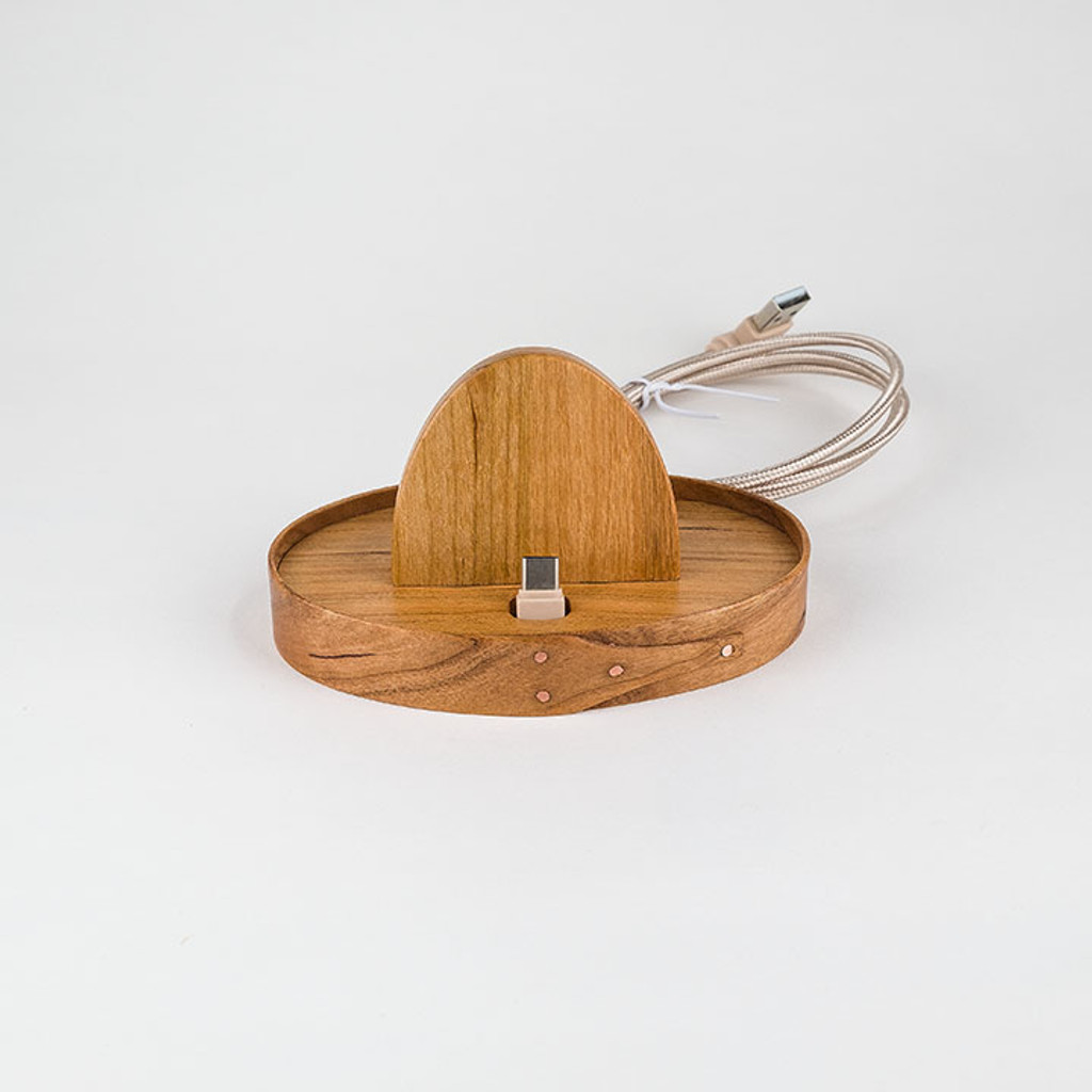 Elegant oval docking station for the newest "fast charge" phones made from fine hardwoods like cherry, oak, maple, or ash.