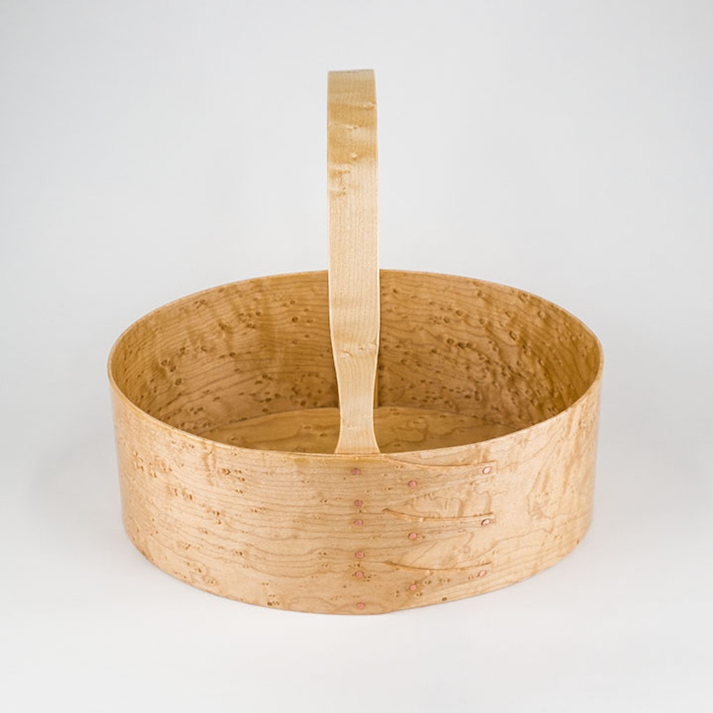 Handcrafted #5 fixed handle carrier in Birdseye Maple organizes knitting and crocheting supplies.