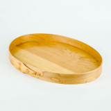 Chefs use #7 oval serving trays to serve hors d'oeuvres to friends or honored guests.