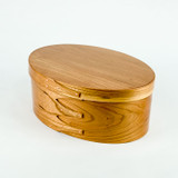 Elegant oval jewelry boxes made from fine hardwoods like cherry, oak, maple, or ash.