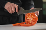 offset DuoGlide bread slicer slicing through a red tomato