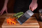 S5198 TRADITIONAL® 8" x 3¼" Chinese Chef's Knife displayed with cut veggies