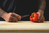 America handle paring knife next to a red pepper