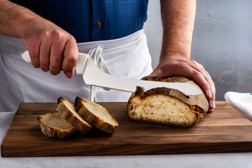 SG163-9SC white handle SOFGRIP® 9" Scalloped Offset Sandwich Knife cutting loaf
