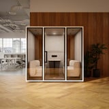 Telefonbox Focus Meet mit Möbel in modernem Büro mit Holzverkleidung, Parkettboden und Pflanze