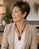 Woman wearing the Carnelian Radiance handcrafted carnelian gemstone necklace by Stone & Story, featuring warm carnelian gemstones and a wire-wrapped statement pendant.