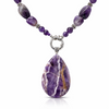 : Close-up of natural amethyst nugget beads with purple variation and silver-tone spacers in artisan necklace