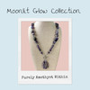 Purely Amethyst Within amethyst statement necklace from the Moonlit Glow Collection displayed on branded collection card