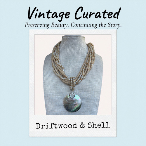 Driftwood & Shell one-of-a-kind Vintage Curated coastal necklace by Stone & Story Jewelry featuring natural coconut shell beads and a mother-of-pearl shell pendant.