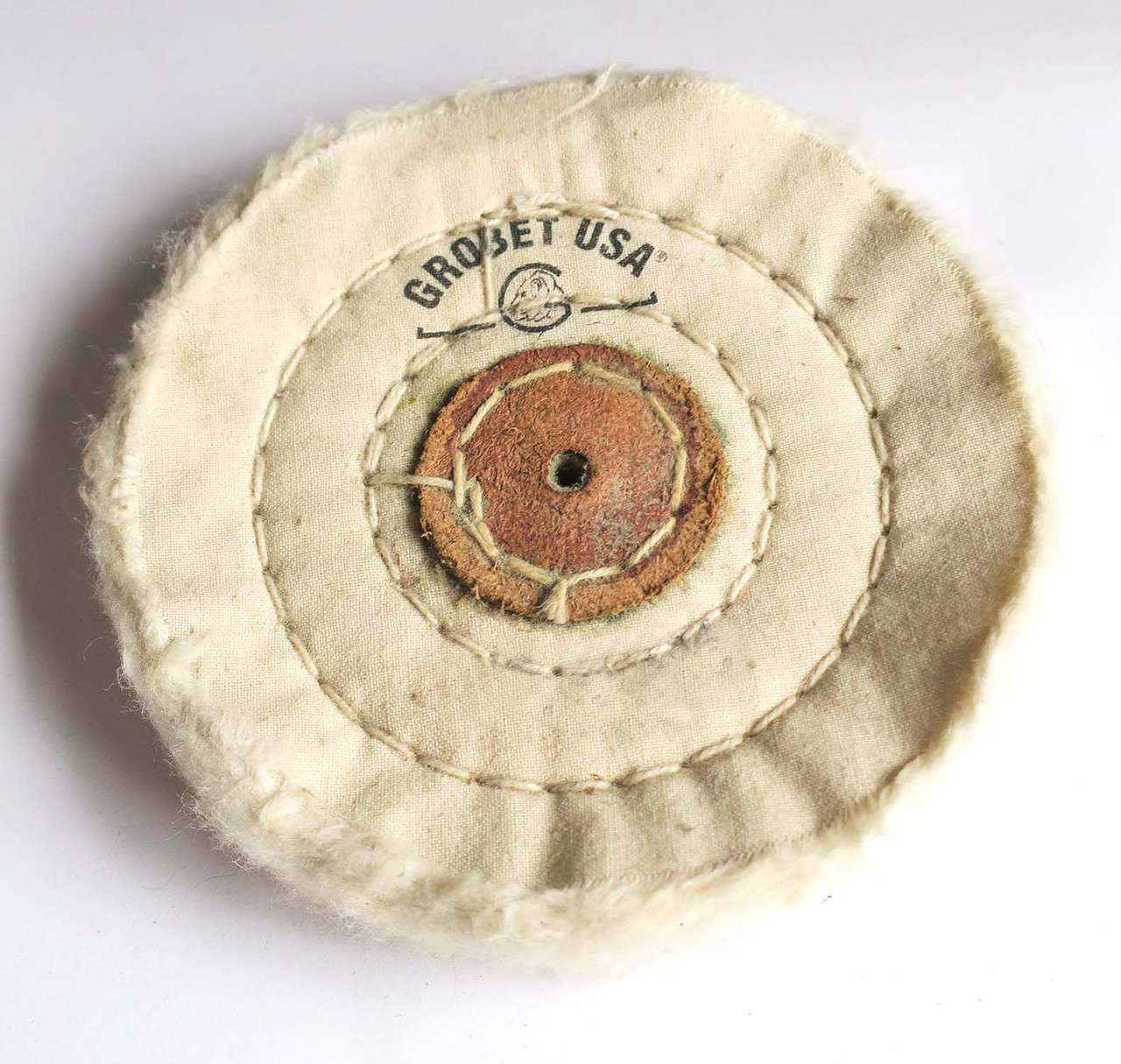 BUFF WHEEL MUSLIN WITH LEATHER CENTERS