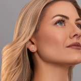 Blond hair woman wearing diamond studs with two marquise diamonds