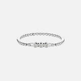 a Diamond Beaded Stretch Bracelet with three diamonds in the center in bezel settings