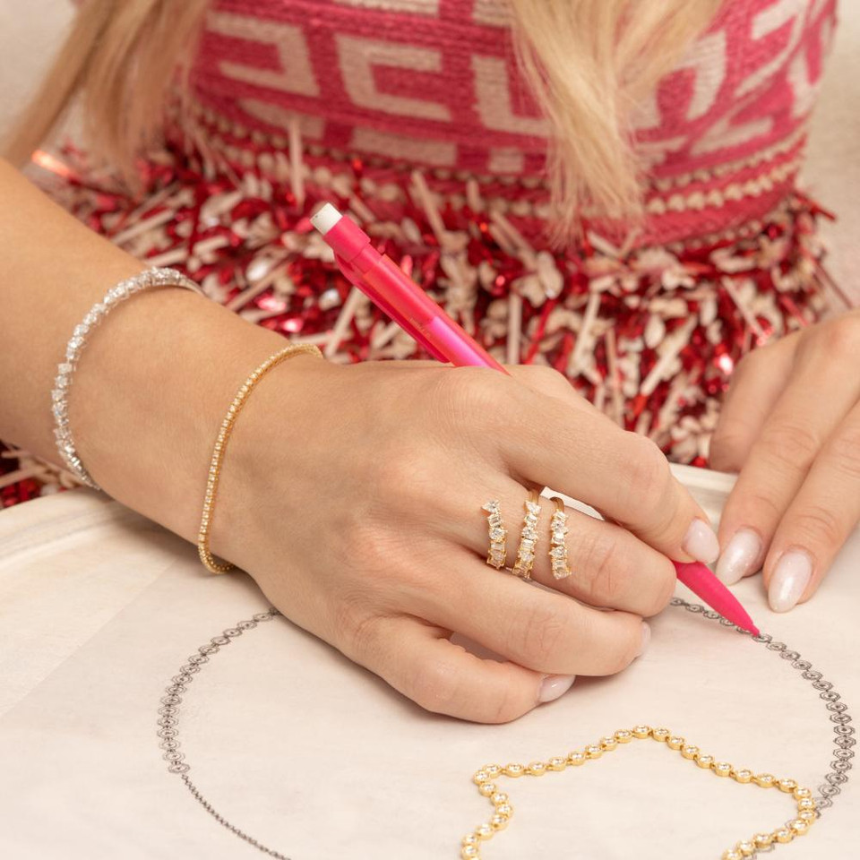 Yellow gold, three row, mix shaped diamond ring with pear and emerald cut diamonds.