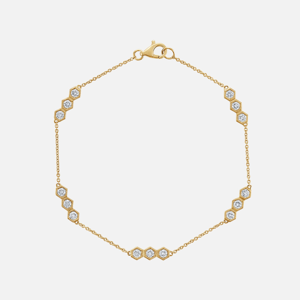 Refined diamond honeycomb station bracelet in yellow gold