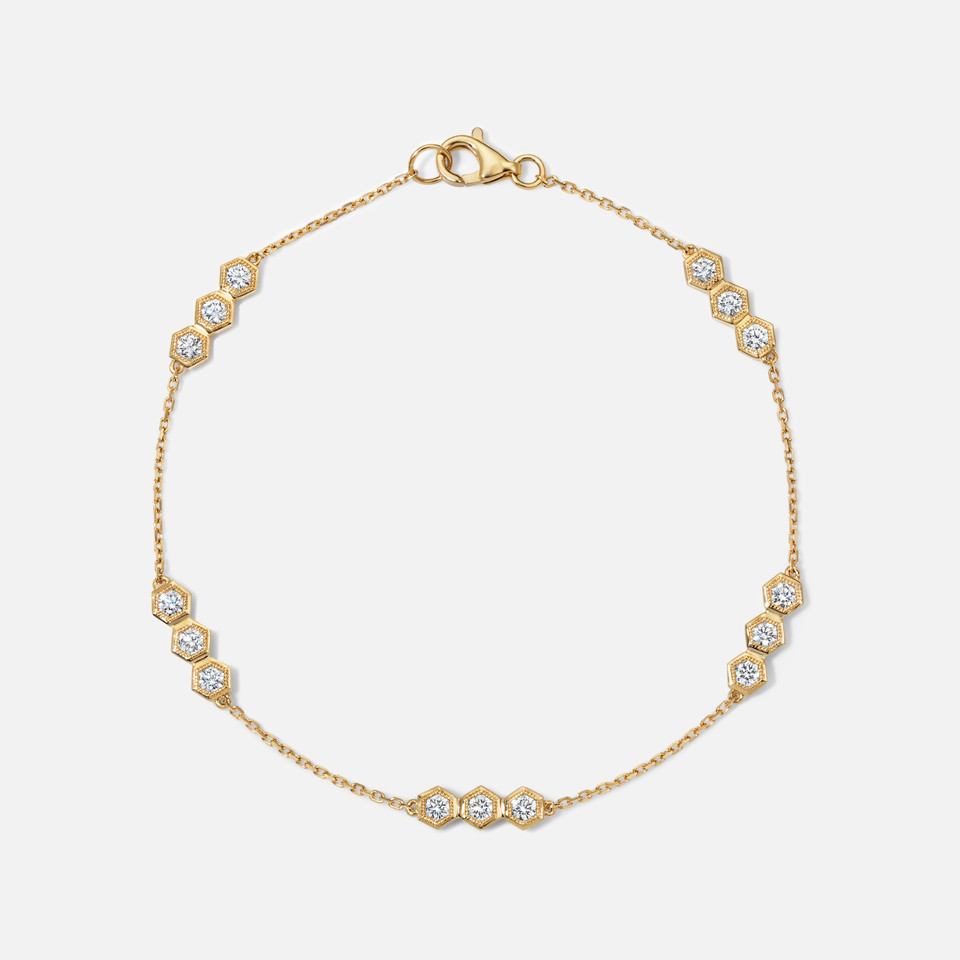 Refined diamond honeycomb station bracelet in yellow gold