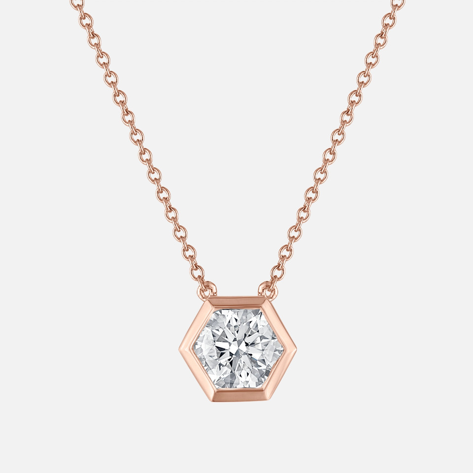 Refined bezel set hexagon shaped diamond pendant in rose gold