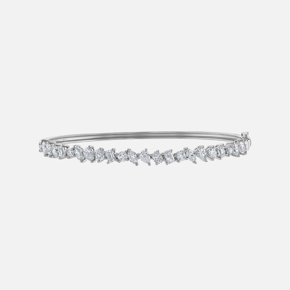 Refined white gold diamond bangle bracelet with pear, marquise, round and emerald cut diamonds