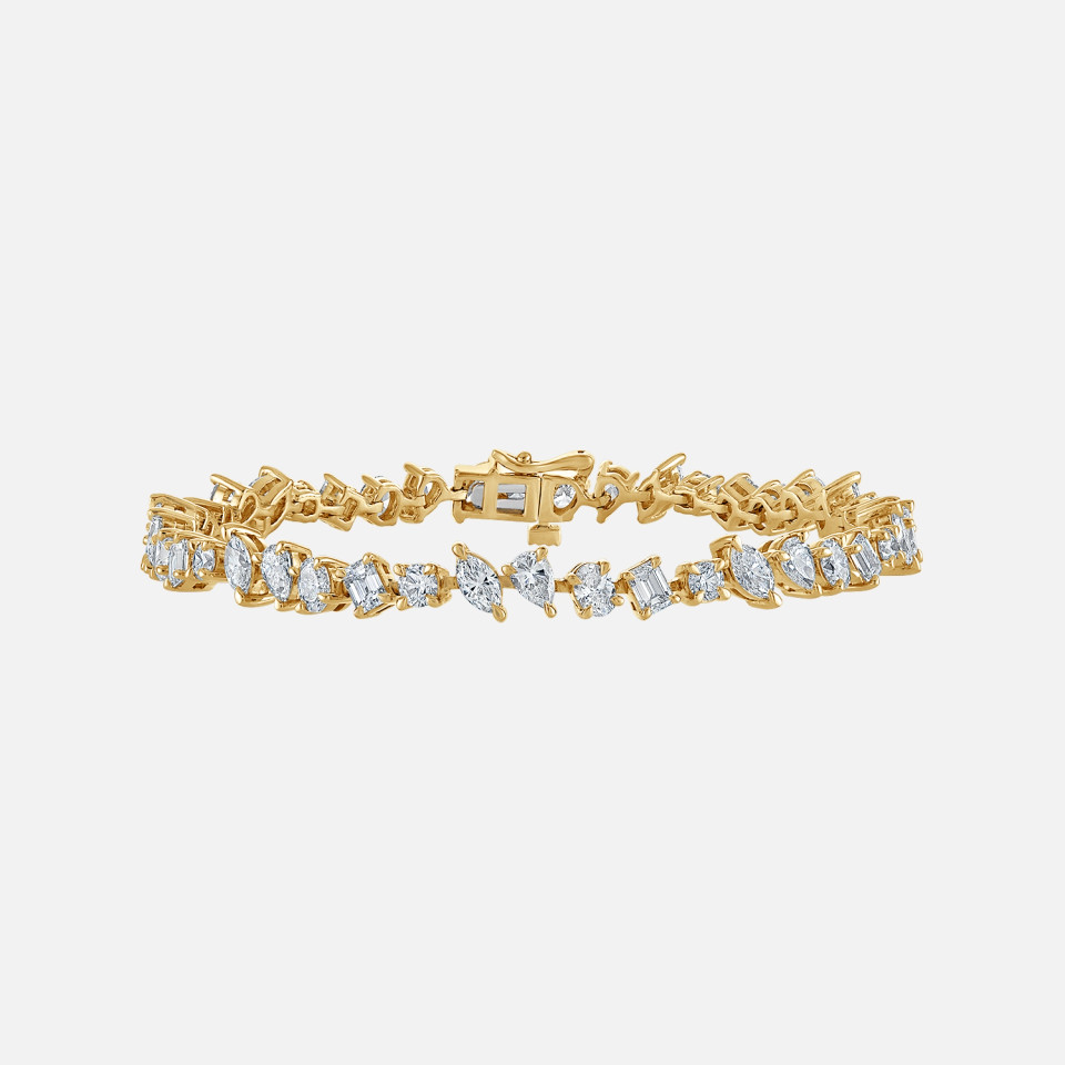 Refined diamond tennis bracelet with mix cut diamonds including matquise, pear, oval and round diamonds