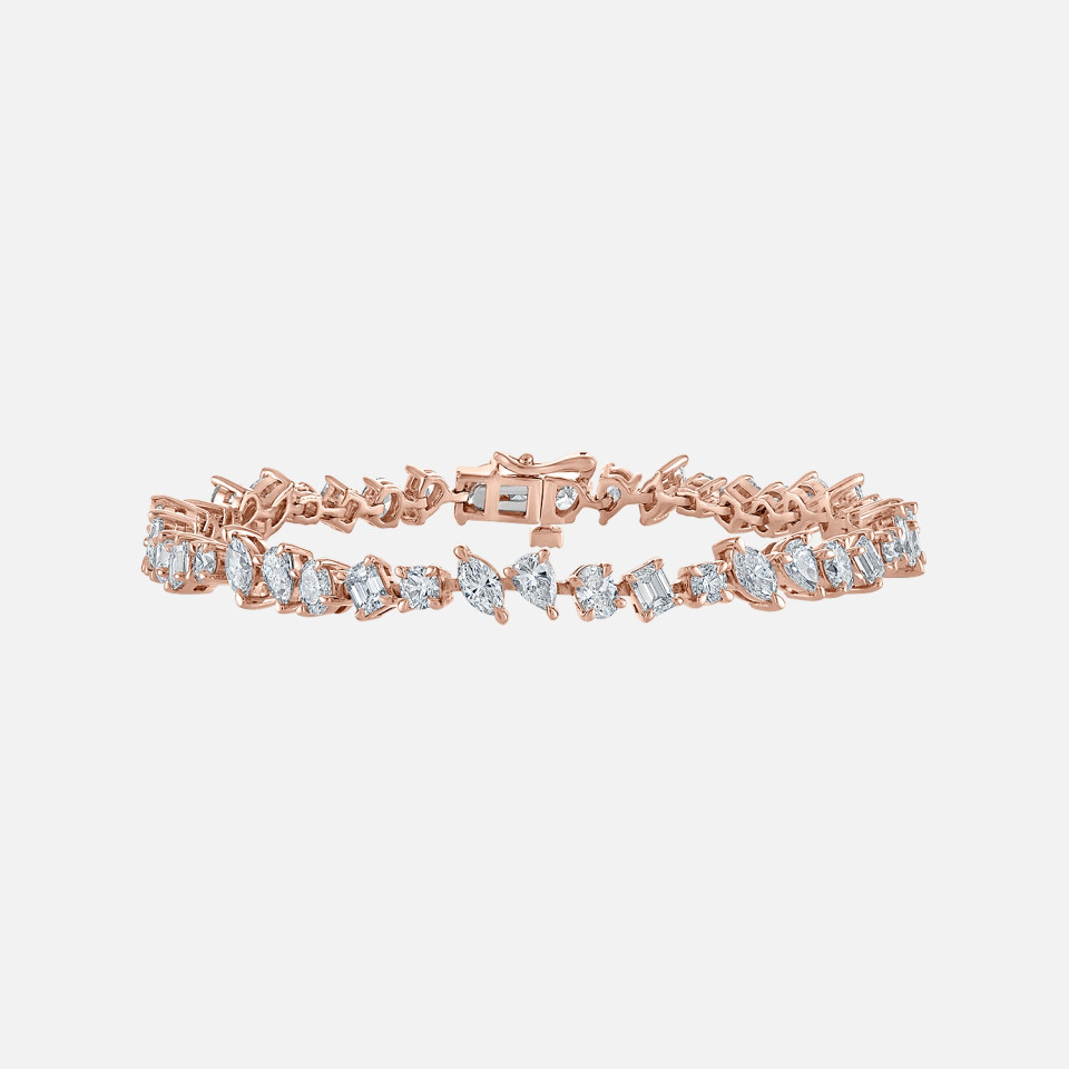 Refined diamond tennis bracelet with mix cut diamonds including matquise, pear, oval and round diamonds