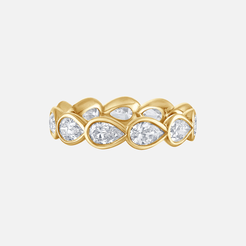 This eternity band features 11 east-west pear-shaped diamonds set in 18k yellow gold.