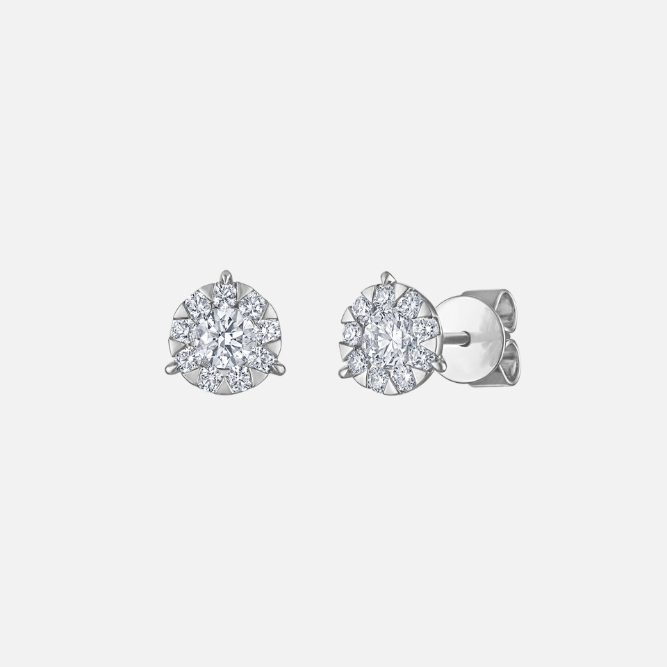 Memoire diamond stud earrings from Razny Jewelers: Center stones surrounded by nine smaller natural diamonds create a bouquet design in these small diamond stud earrings.