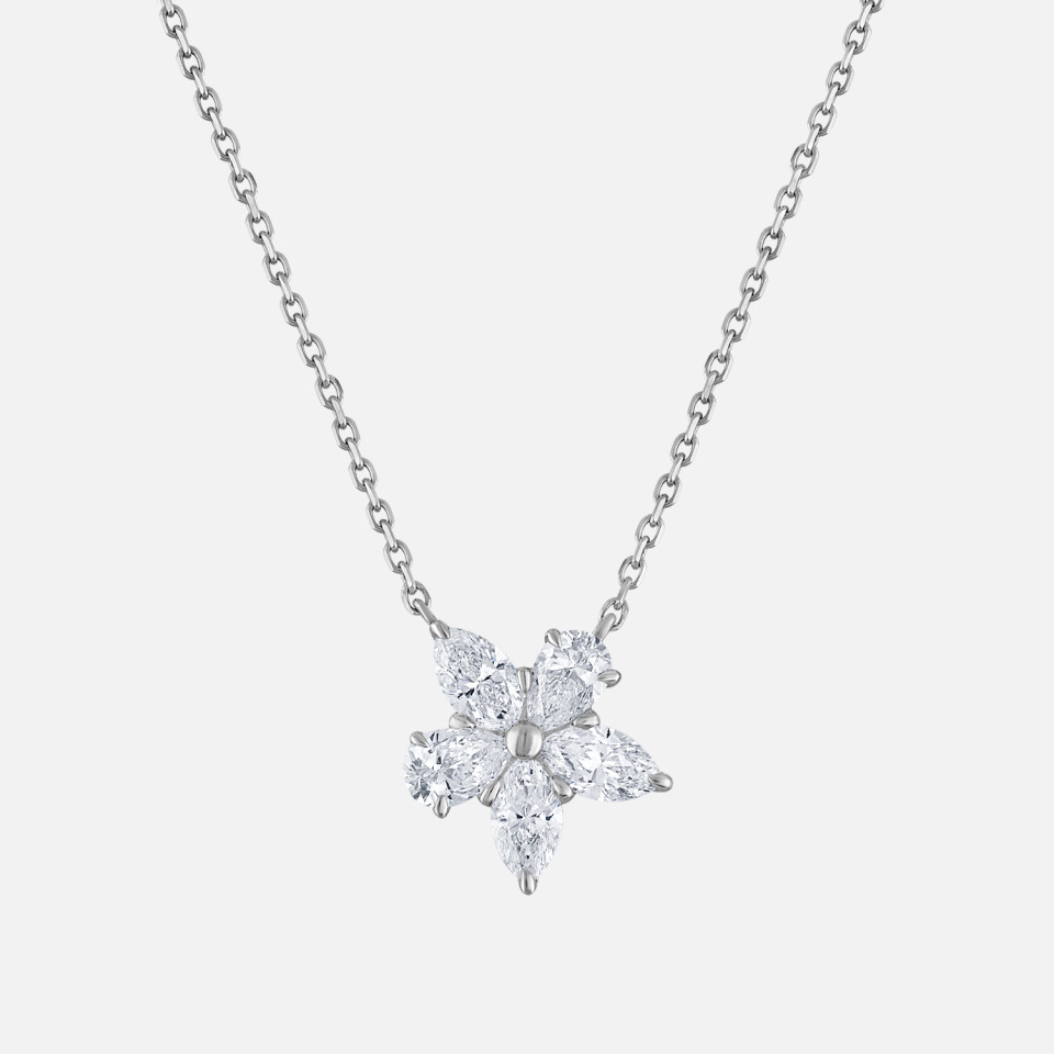 This natural diamond flower necklace, part of the Refined by Razny collection, features exquisite marquise and pear-shaped diamonds in 18k solid gold, creating a sophisticated and contemporary design that elevates any ensemble.