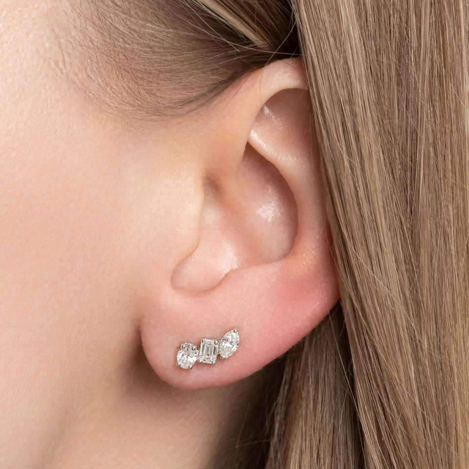 diamond ear crawler style earrings seen on an ear