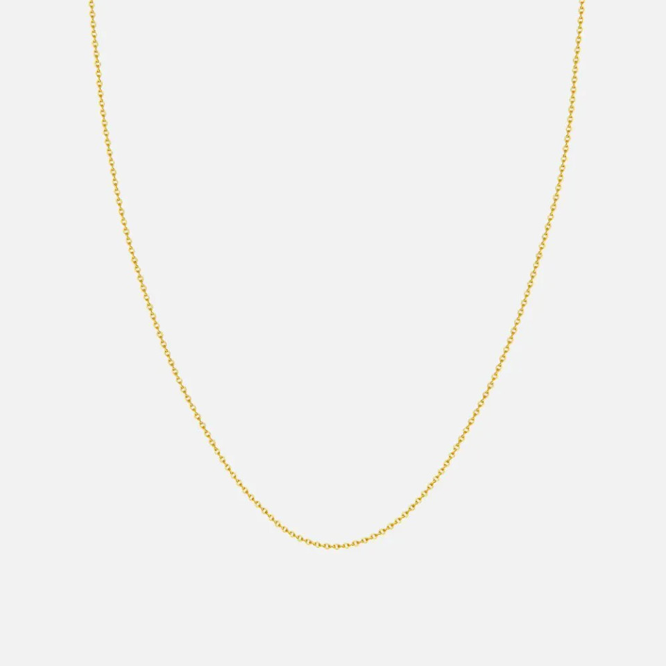 This classic 1.5 mm cable chain is crafted in 14K gold and finished with a secure lobster clasp. Available at Razny Jewelers.