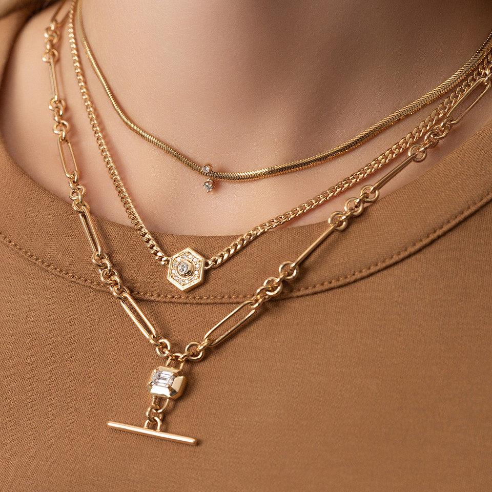 Lifestyle image of lady wearing Gold Emerald-Cut Diamond Faux Toggle Large Paperclip and Rolo Chain Lariat Necklace