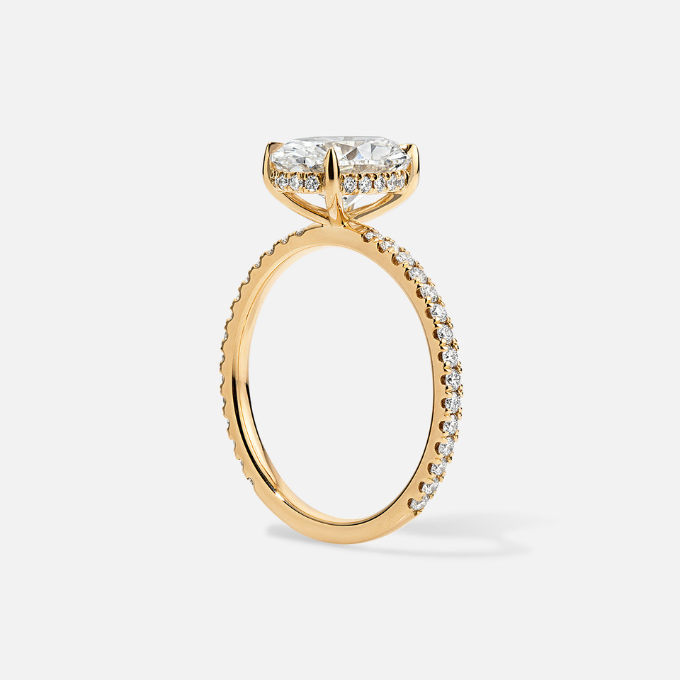 Side view of 18k Yellow Gold Accent Full Pave Semi-Mount for Oval Diamond