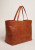 Pasadena Bag in tan-colored glossy hammered leather with gold logo on the front