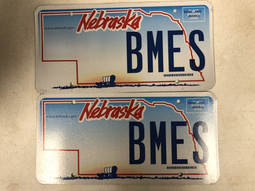 Expired NEBRASKA www . nebraska . gov License Plate BMES PAIR Covered Wagon Ox Prairie 