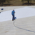 Ames Premium Roof Armor® being sprayed on metal roof