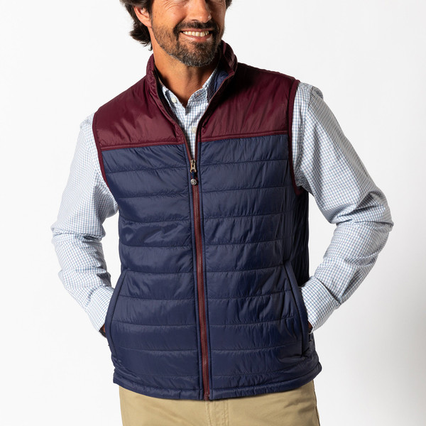 Man wearing Tom Beckbe Ridgeland Performance Vest men’s vest front view| color: Maritime| C. Field & Roe | Dublin, Ohio